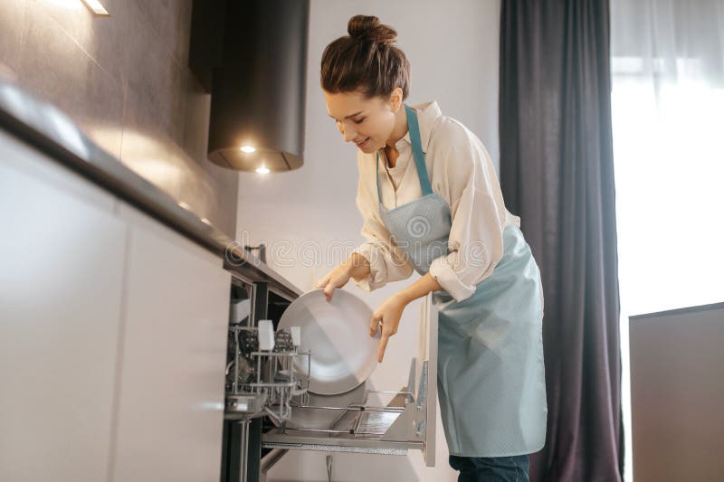 dish-washing-woman-standing-near-dishwasher-taking-plates-out-woman-standing-near-dishwasher-taking-plates-out-236889269